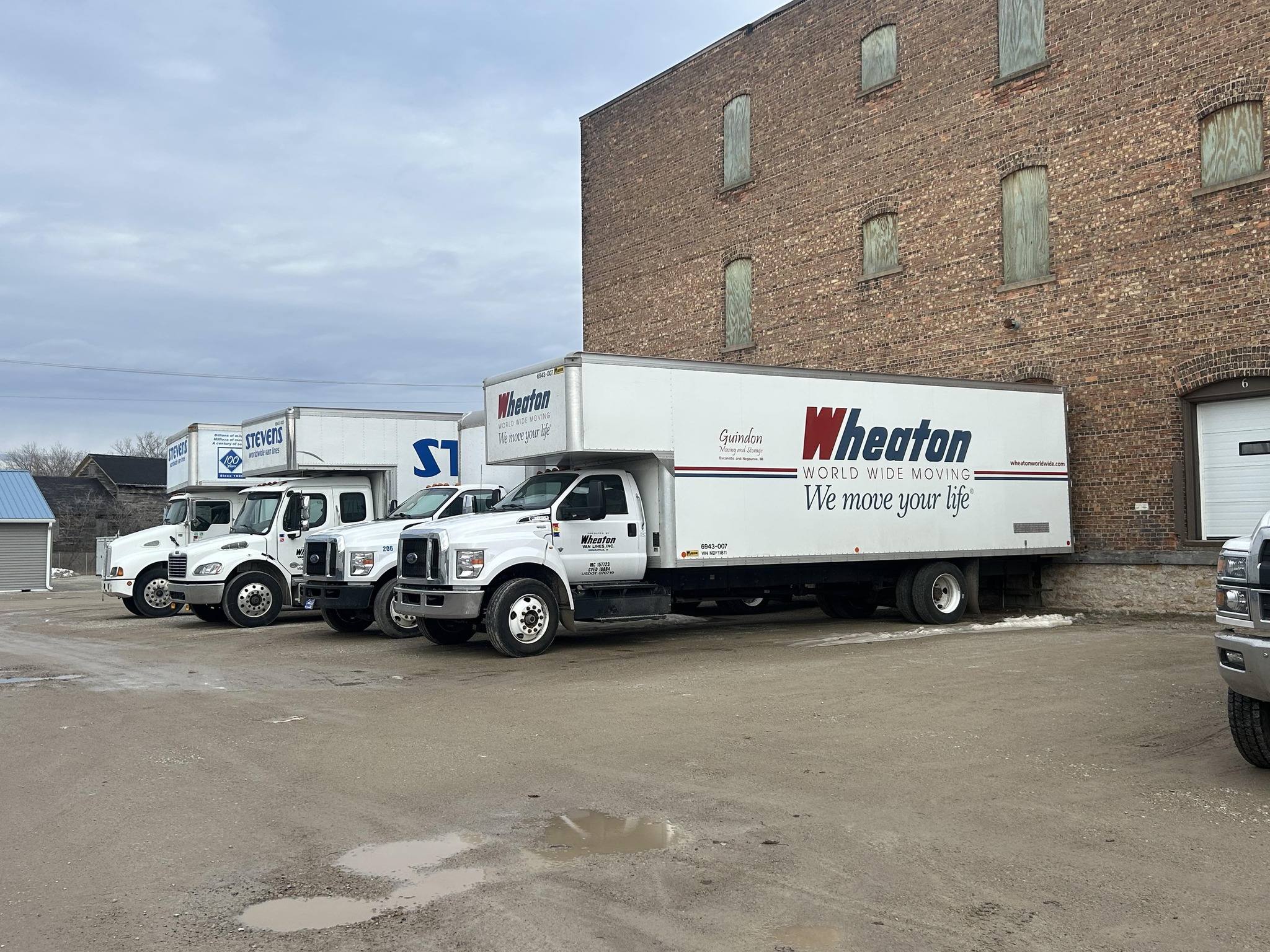 4 trucks outside Guindon's office